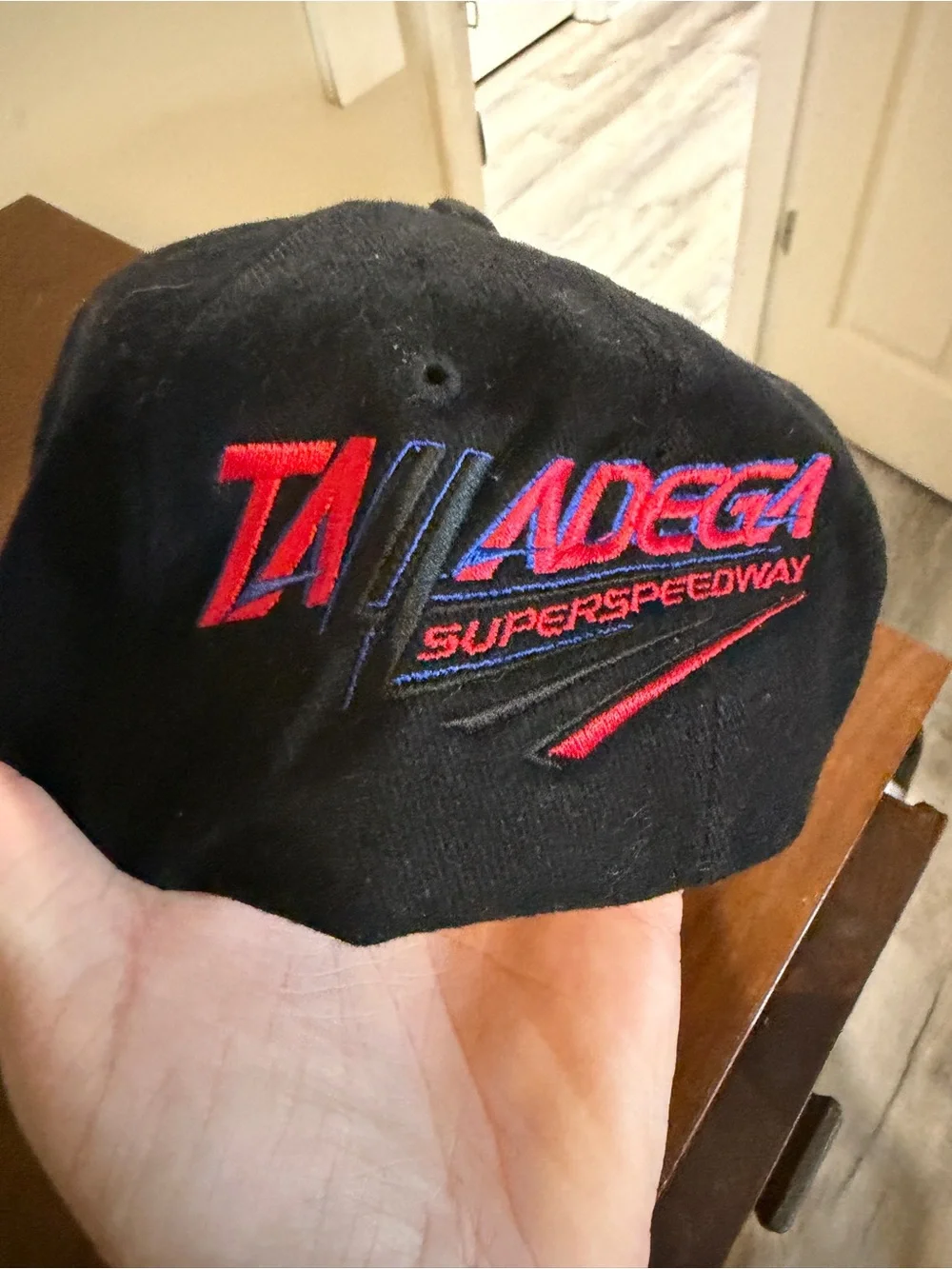 Truck Tour Black Baseball Cap with Red Logo